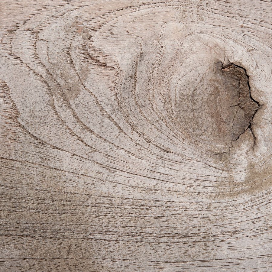 Close-up of premium furniture material under stress testing, showing construction detail and fiber integrity.